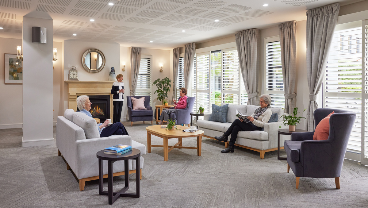 Menzies Malvern lounge area with comfortable seating and cozy fireplace