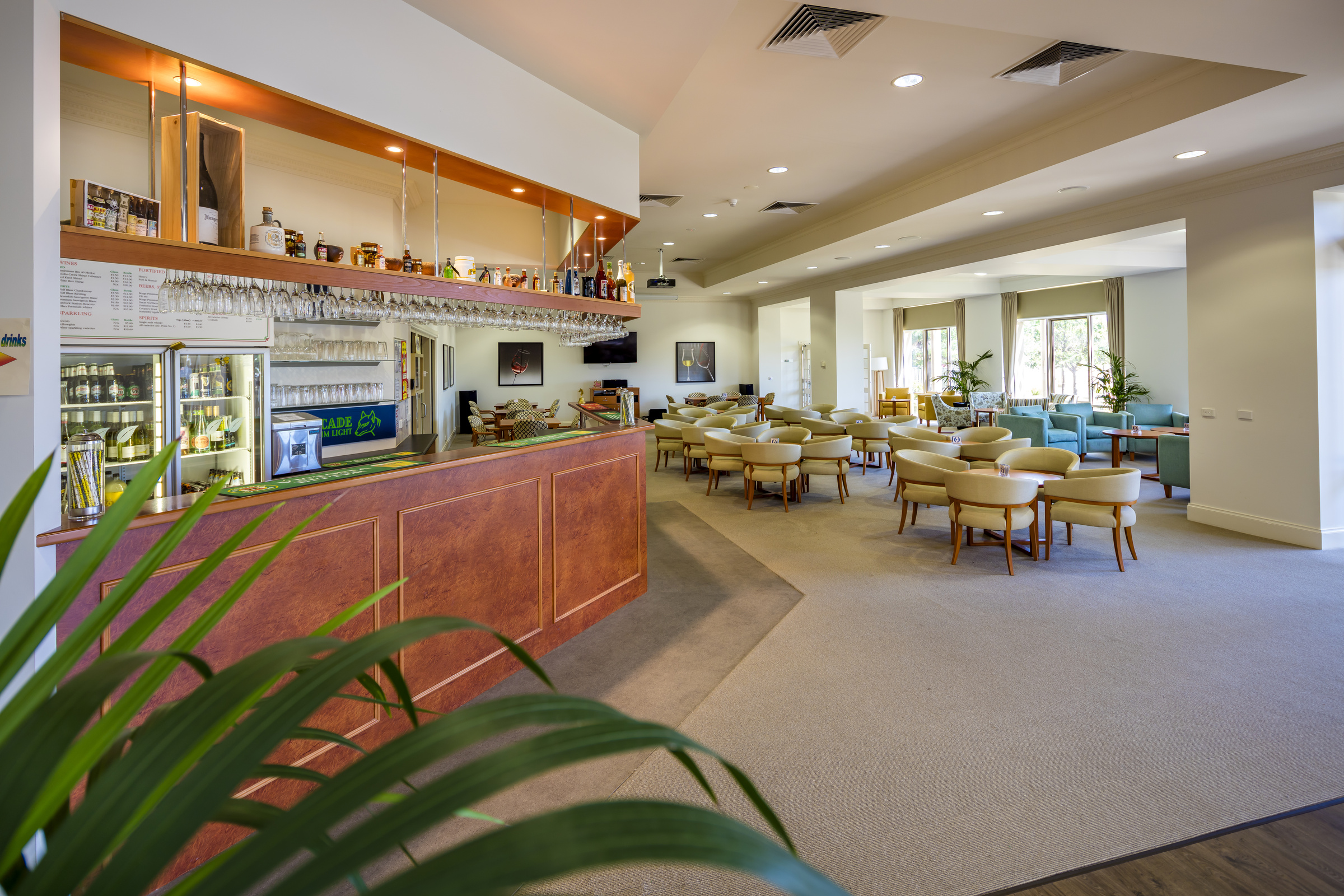 Waterford Valley Lakes bar with stocked drinks fridge and seating area